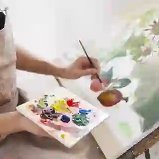 Woman painting a picture.