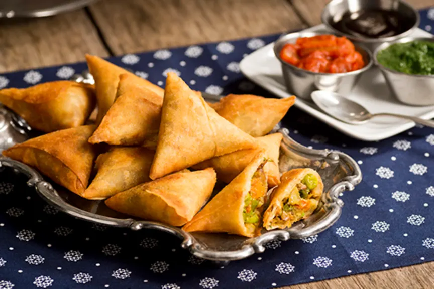 Vegetarian samosas with chutney.
