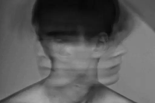 black and white photo of man shaking head