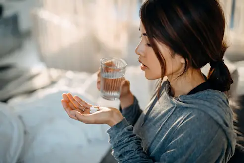 Woman taking pills