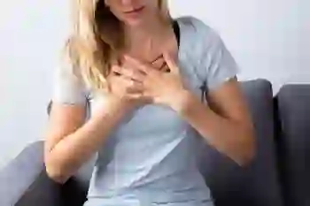 Woman suffering from heartburn.