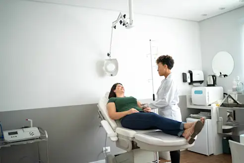A woman consults with a dermatologist