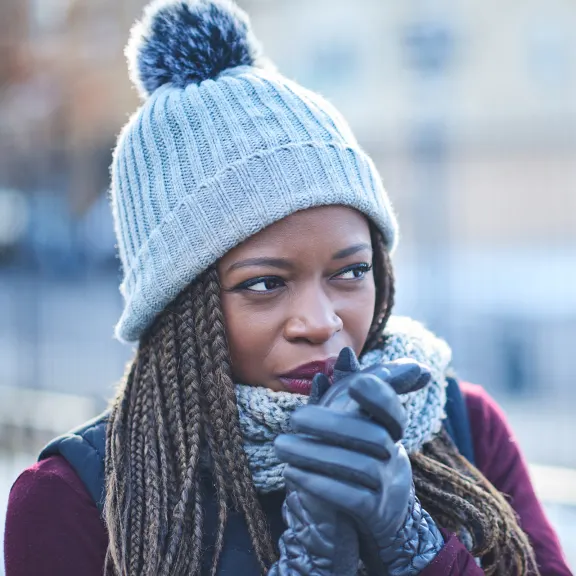 Woman bundled up while outside during winter