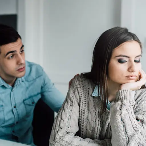 man trying to talk to woman, woman pulling away