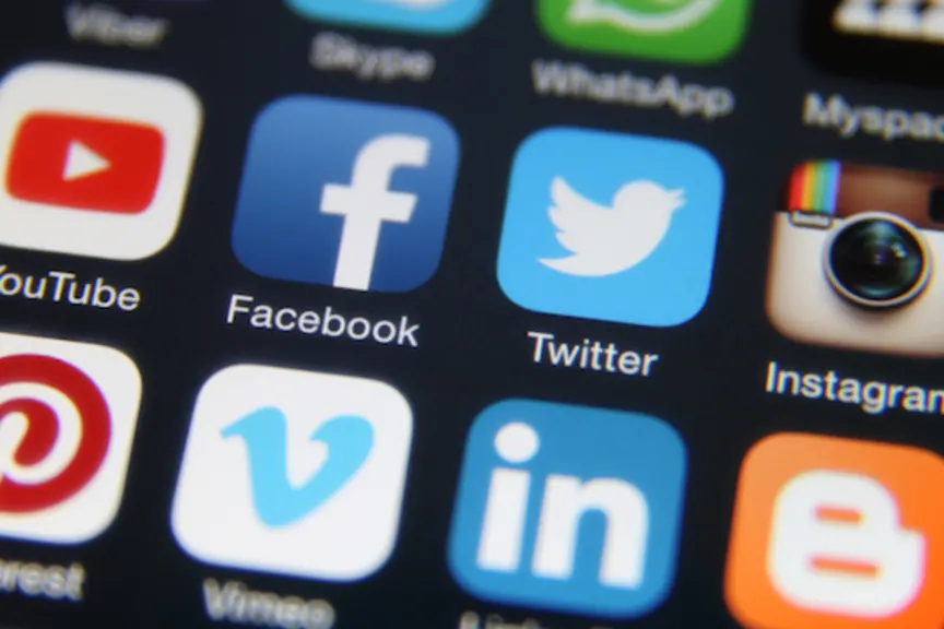 Social media icons on screen.