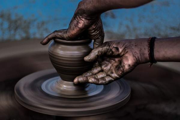 Close up of hands doing pottery