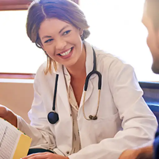 Doctor showing a patient positive test results.