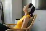 Woman relaxing while wearing headphones