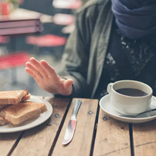 Woman avoiding wheat food products.