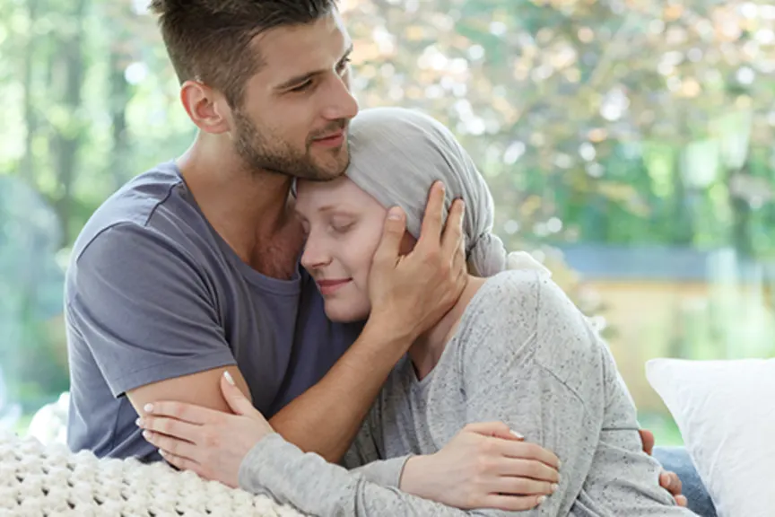 Husband comforting his wife with cancer.