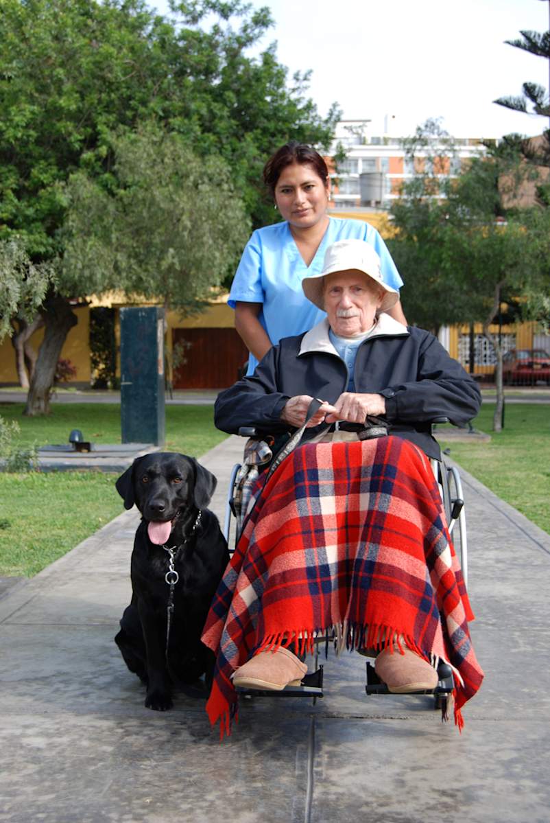 JohnDrakeAndhisCaregiverAndhisDog LolaLimaPeru 2011