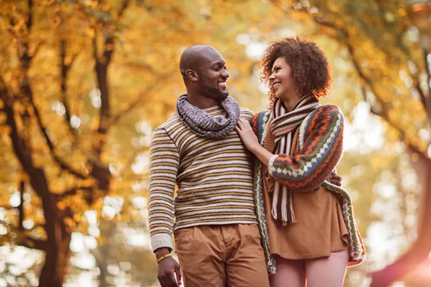 Happy couple taking a walk in Autumn.