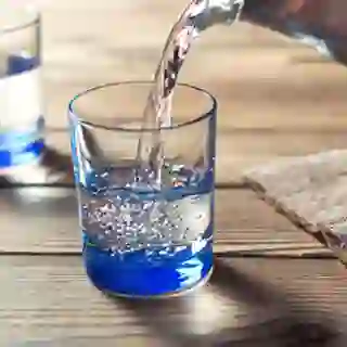 Pouring water into a glass.