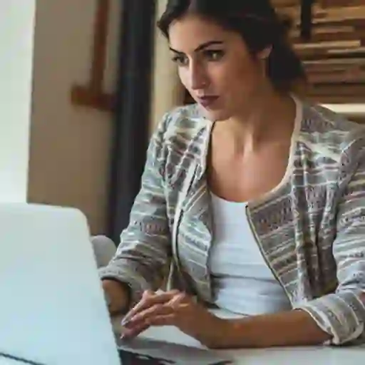 Young woman working on laptop.