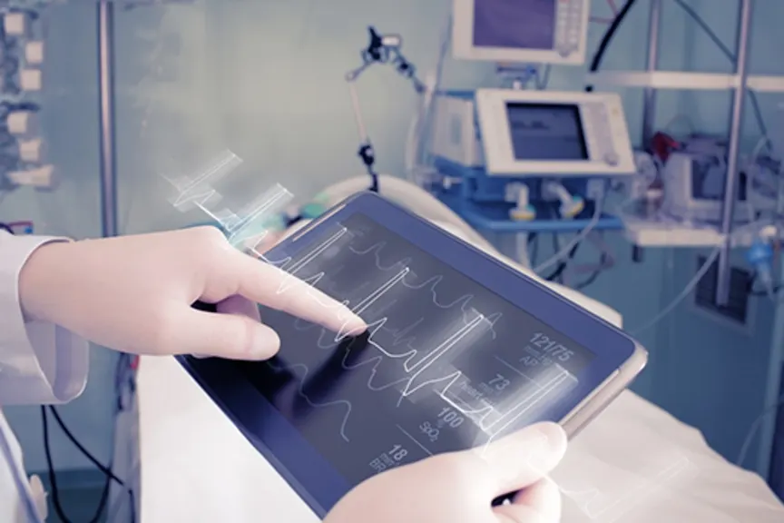 Doctor examining patient's heart rate on a tablet.