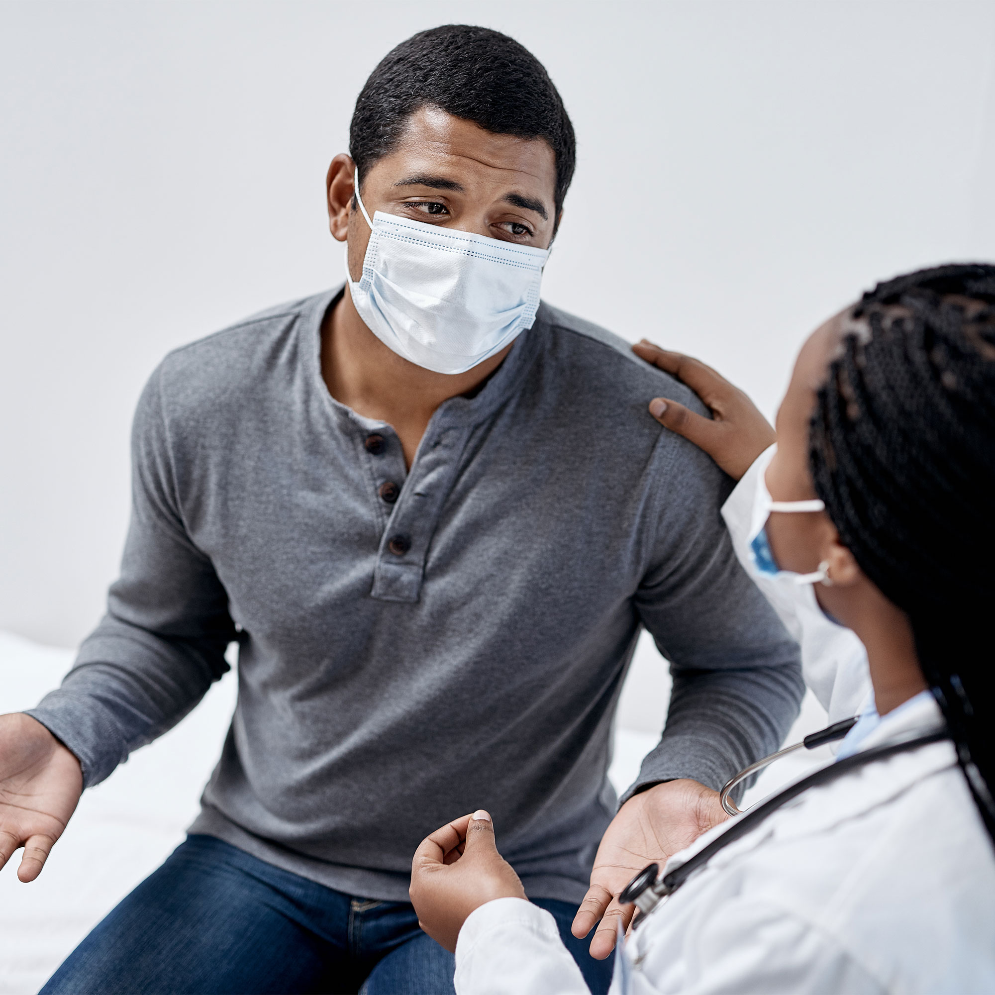 A man speaks to his doctor