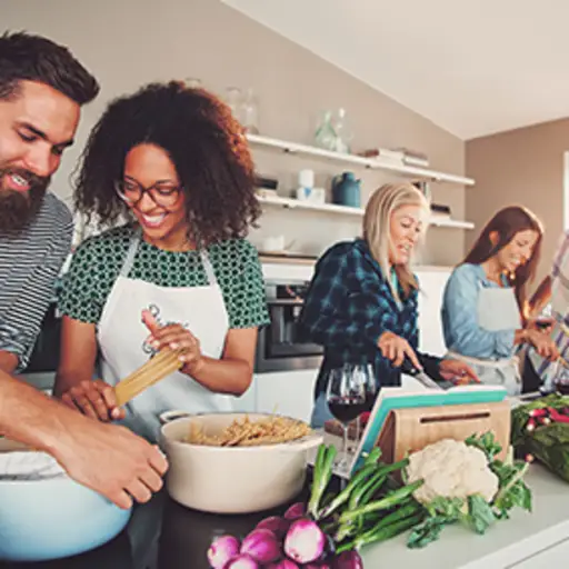 Friends cooking together.