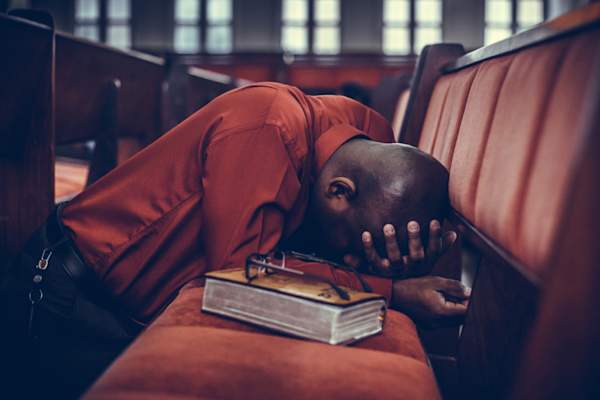 depressed man in church