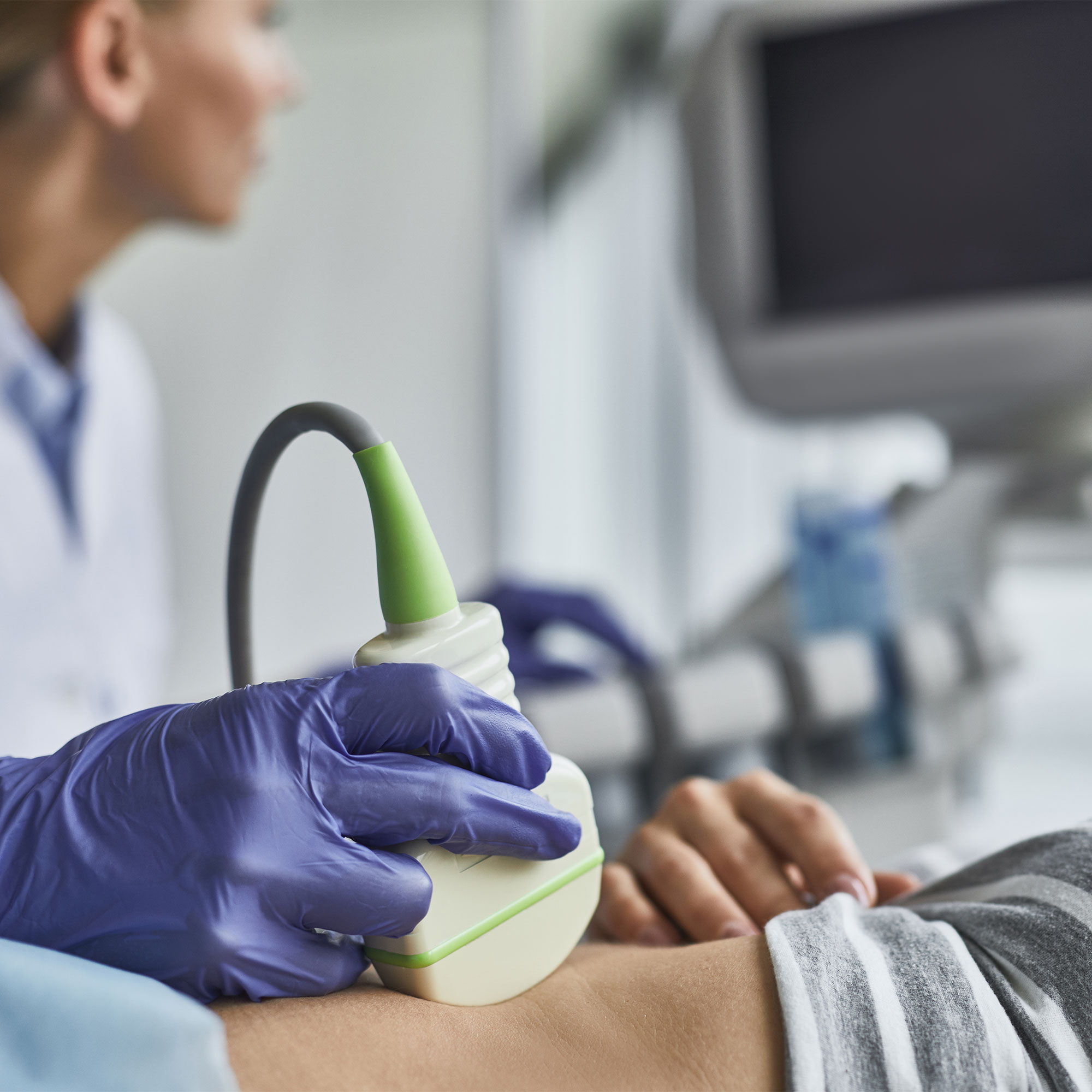 An ultrasound is performed on a woman’s abdomen