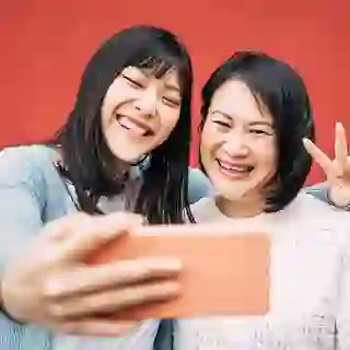 Mother and daughter posing for a selfie