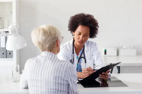 A doctor explains a treatment plan to a patient