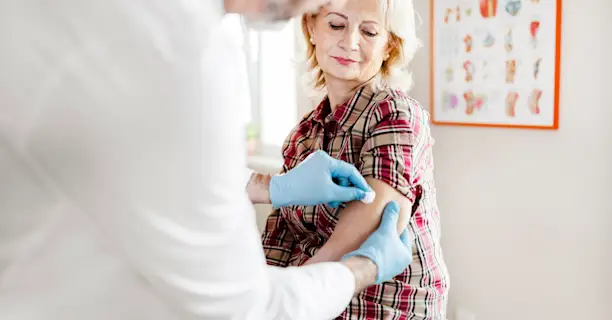 Middle age woman getting a vaccination