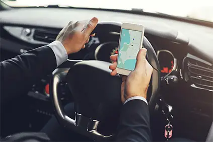 Man using GPS in car.