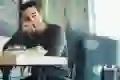 A man eats inside a cafe