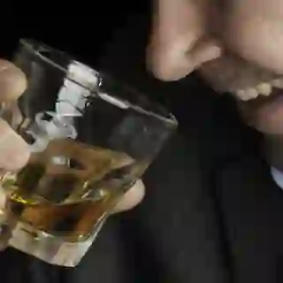 drinking whiskey