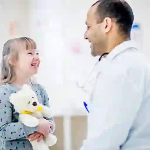 Child with Down syndrome with a doctor.