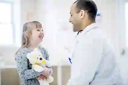 Child with Down syndrome with a doctor.