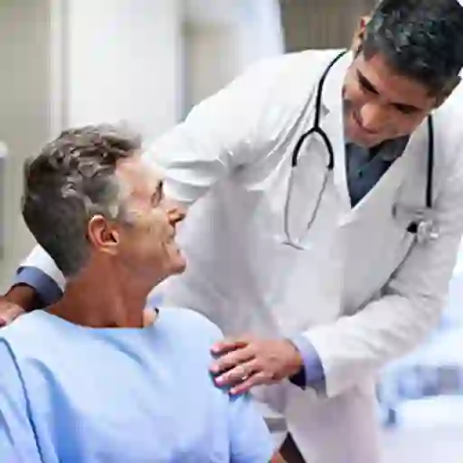 Middle age male patient talking to his doctor about leukemia diagnosis.