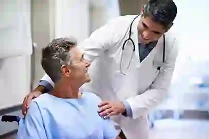 Middle age male patient talking to his doctor about leukemia diagnosis.