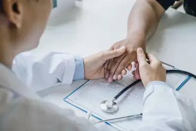 doctor checking hand