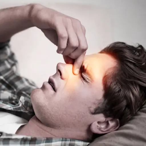 Man dealing with sinus infection.