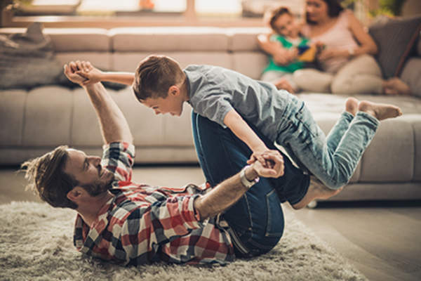Man playing with his son could trigger a rheumatoid arthritis flare.