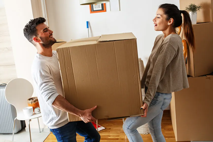couple moving large box image