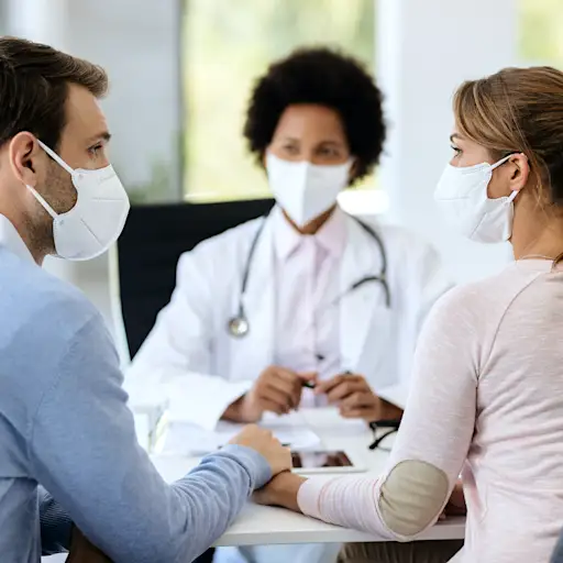 couple talking to doctor