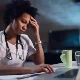 nurse on night shift looking frustrated