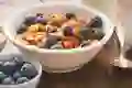 A view of blueberries and nuts in a bowl