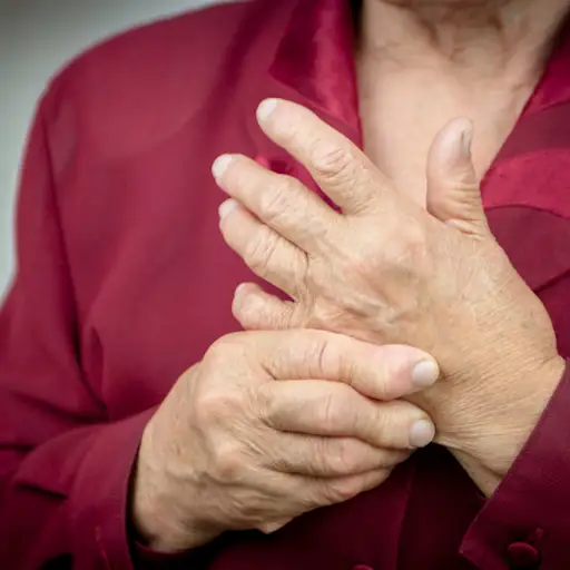 person touching swollen knuckles