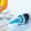 A view of a syringe and pills