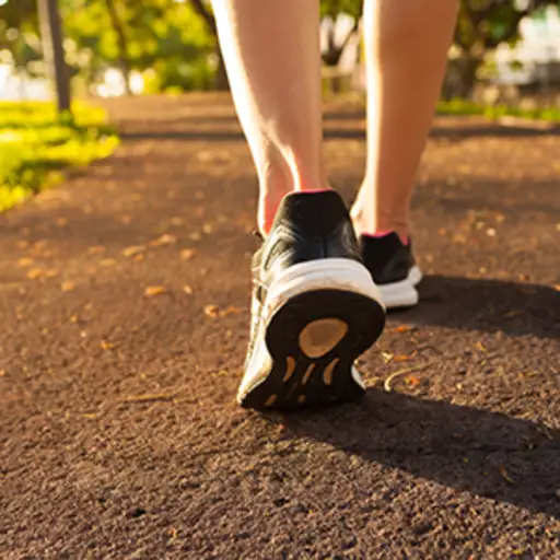 Woman walking on a path outside