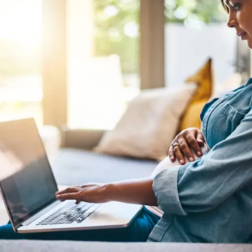 Pregnant woman on laptop