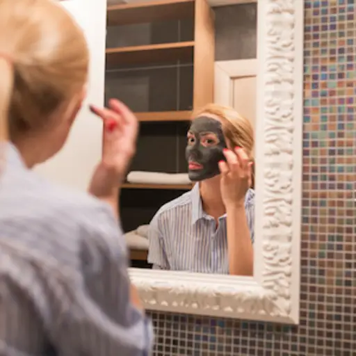 Mud mask on face