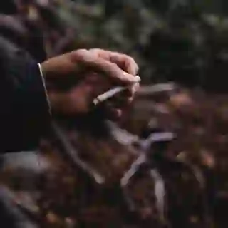 hand holding cigarette