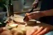 Hands chopping root vegetables
