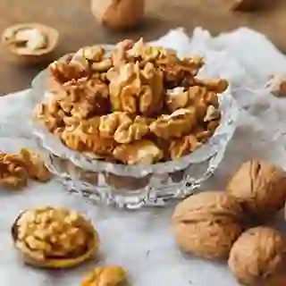 Glass bowl with walnuts on rustic homespun napkin