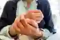 A woman rubs her hands