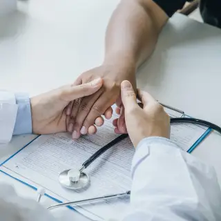 doctor checking hand
